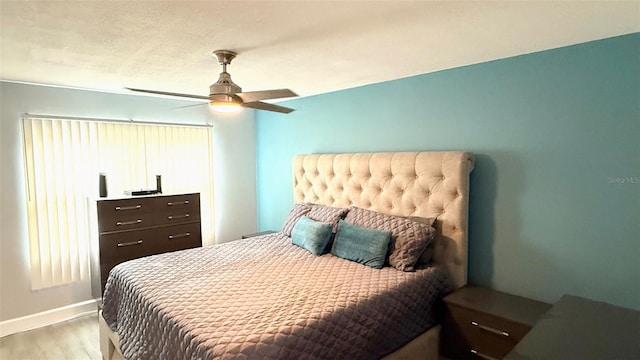 6400 46th Ave N Unit 113, Kenneth City, FL 33709 - bedroom featuring wood finished floors, baseboards, and ceiling fan