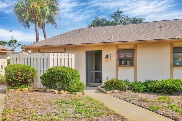 2906 63rd St W Unit 206, Bradenton, FL 34209 - entrance to property featuring stucco siding and a shingled roof