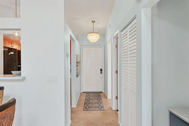 2906 63rd St W Unit 206, Bradenton, FL 34209 - hall featuring a chandelier and light tile patterned floors