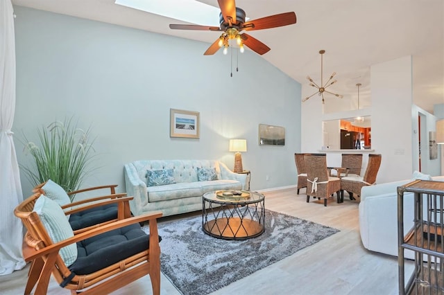 2906 63rd St W Unit 206, Bradenton, FL 34209 - living room with high vaulted ceiling, wood finished floors, baseboards, and a ceiling fan