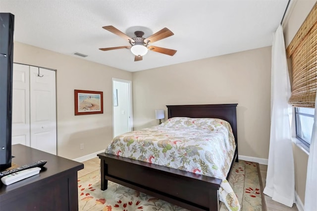 2906 63rd St W Unit 206, Bradenton, FL 34209 - bedroom with baseboards, a closet, and ceiling fan