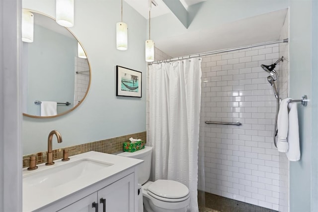 2906 63rd St W Unit 206, Bradenton, FL 34209 - full bathroom featuring toilet, tiled shower, vanity, and tile walls