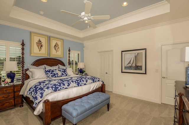 26687 Raphis Royale Blvd, Englewood, FL 34223 - bedroom with a tray ceiling, light carpet, ornamental molding, recessed lighting, and a ceiling fan