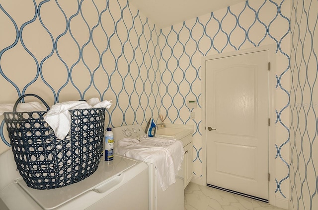 26687 Raphis Royale Blvd, Englewood, FL 34223 - laundry room featuring washer / dryer and light marble finish floors
