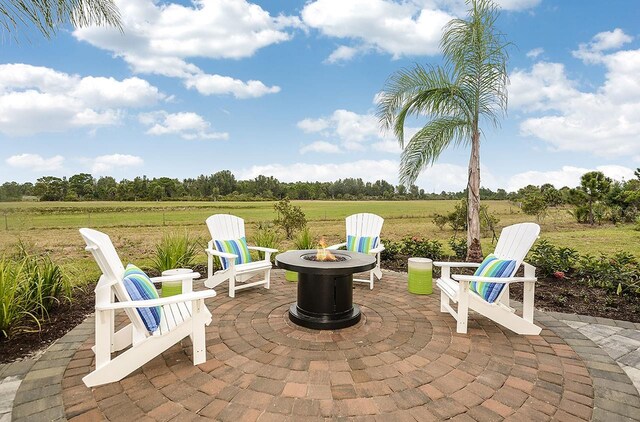 26687 Raphis Royale Blvd, Englewood, FL 34223 - view of patio / terrace with a fire pit and a view of countryside