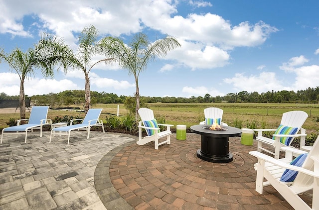 26687 Raphis Royale Blvd, Englewood, FL 34223 - view of patio with a fire pit and a view of countryside