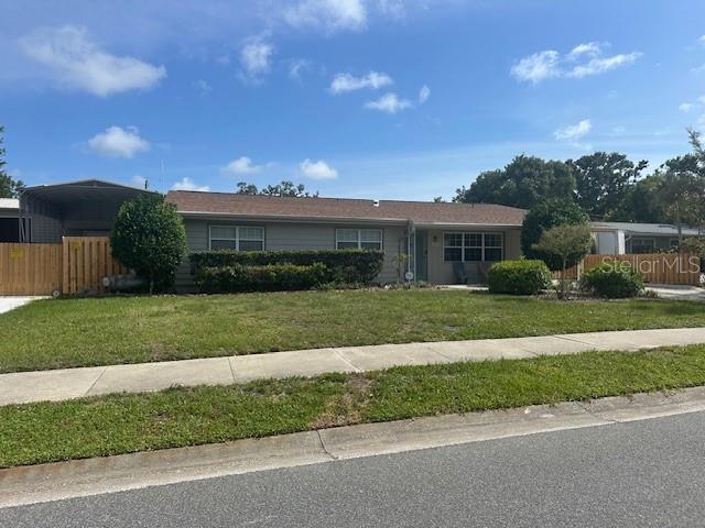 3060 Courtland St, Sarasota, FL 34237 - ranch-style home featuring a carport