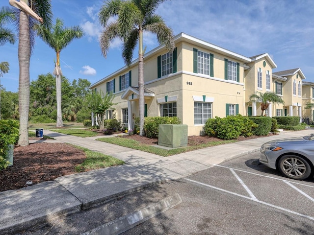 262 Cape Harbour Loop Unit 101, Bradenton, FL 34212 - view of building exterior featuring uncovered parking