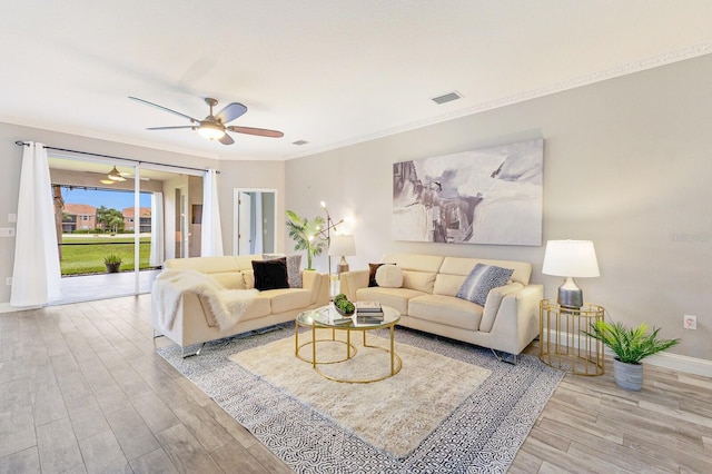 8640 Stone Harbour Loop, Bradenton, FL 34212 - living room with wood finished floors, a ceiling fan, ornamental molding, and baseboards