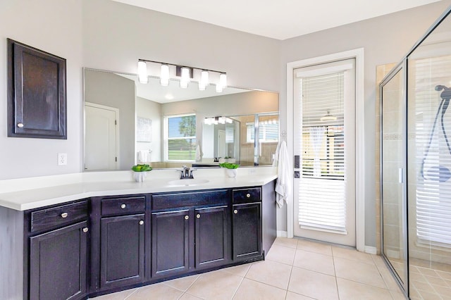 8640 Stone Harbour Loop, Bradenton, FL 34212 - bathroom featuring vanity, a shower stall, tile patterned floors, and baseboards