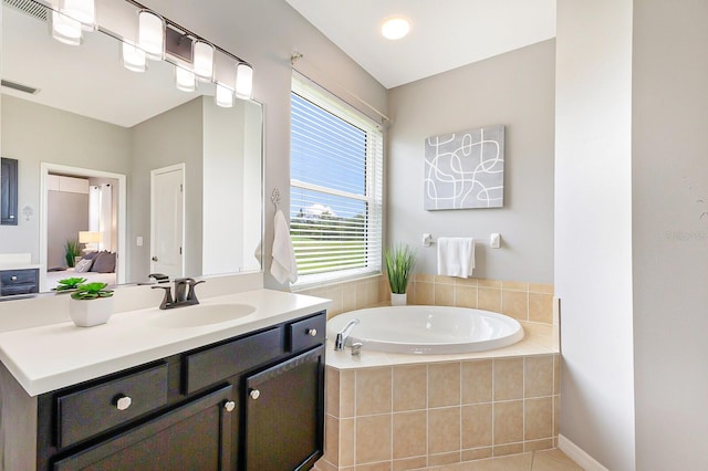 8640 Stone Harbour Loop, Bradenton, FL 34212 - bathroom with a garden tub, vanity, and tile patterned flooring