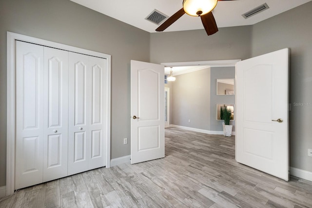 8640 Stone Harbour Loop, Bradenton, FL 34212 - unfurnished bedroom with a closet, light wood-type flooring, baseboards, and ceiling fan
