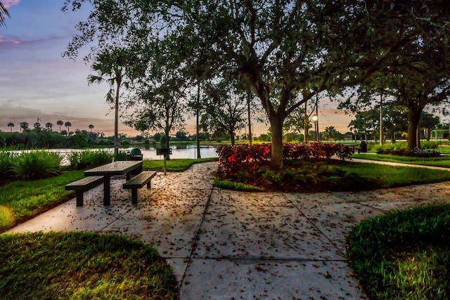 8640 Stone Harbour Loop, Bradenton, FL 34212 - view of community featuring a water view and a patio
