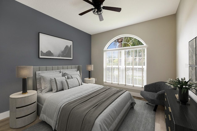 8640 Stone Harbour Loop, Bradenton, FL 34212 - bedroom featuring wood finished floors, baseboards, and ceiling fan
