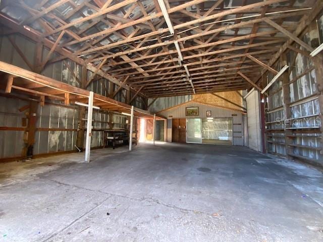 6923 13th Ave E, Bradenton, FL 34208 - miscellaneous room featuring a garage and vaulted ceiling