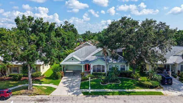 4612 4th Ave E, Bradenton, FL 34208 - view of front of house with concrete driveway, an attached garage, and a front yard