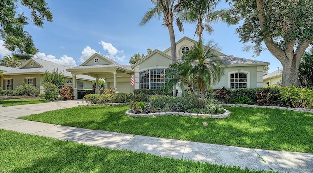 4612 4th Ave E, Bradenton, FL 34208 - ranch-style house with stucco siding, a front yard, and driveway