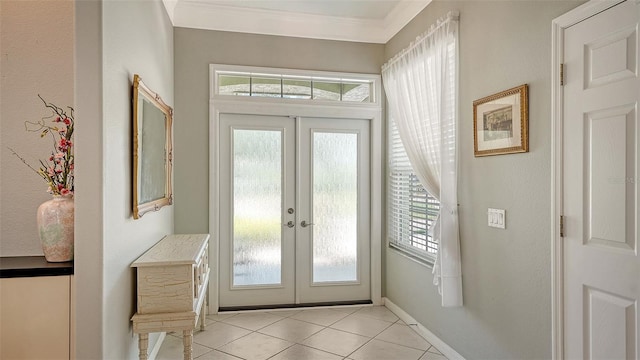 4612 4th Ave E, Bradenton, FL 34208 - foyer entrance with french doors, light tile patterned floors, healthy amount of natural light, and ornamental molding