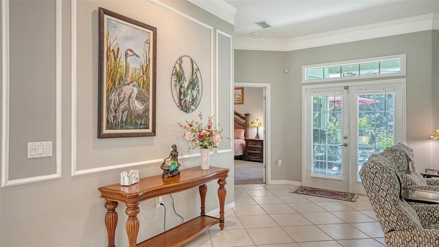 4612 4th Ave E, Bradenton, FL 34208 - entrance foyer featuring ornamental molding, light tile patterned floors, and baseboards