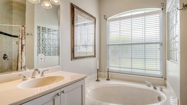 4612 4th Ave E, Bradenton, FL 34208 - bathroom with a bath, vanity, and a tile shower