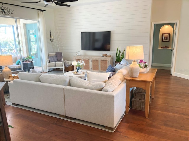 2149 Muskogee Trl, Nokomis, FL 34275 - living room featuring wood finished floors, ceiling fan, baseboards, and wooden walls