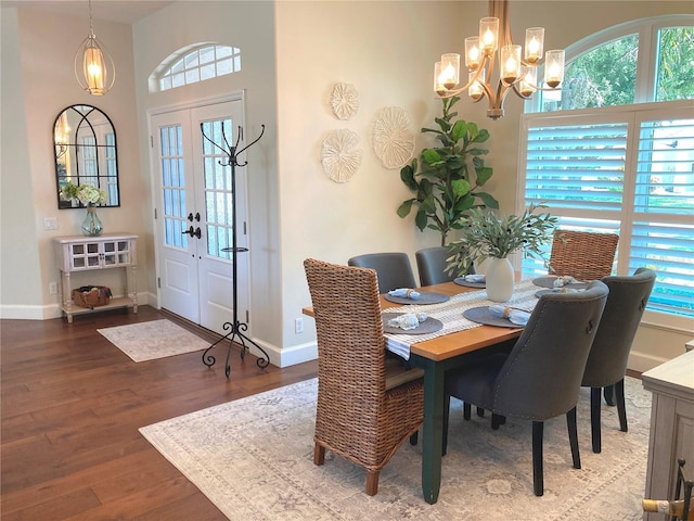 2149 Muskogee Trl, Nokomis, FL 34275 - dining room featuring a chandelier, plenty of natural light, wood finished floors, and baseboards