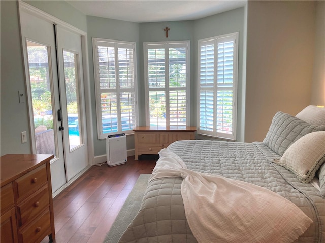 2149 Muskogee Trl, Nokomis, FL 34275 - bedroom with access to exterior and dark wood finished floors