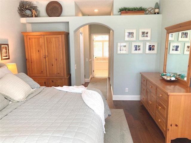 2149 Muskogee Trl, Nokomis, FL 34275 - bedroom with wood finished floors, arched walkways, and baseboards