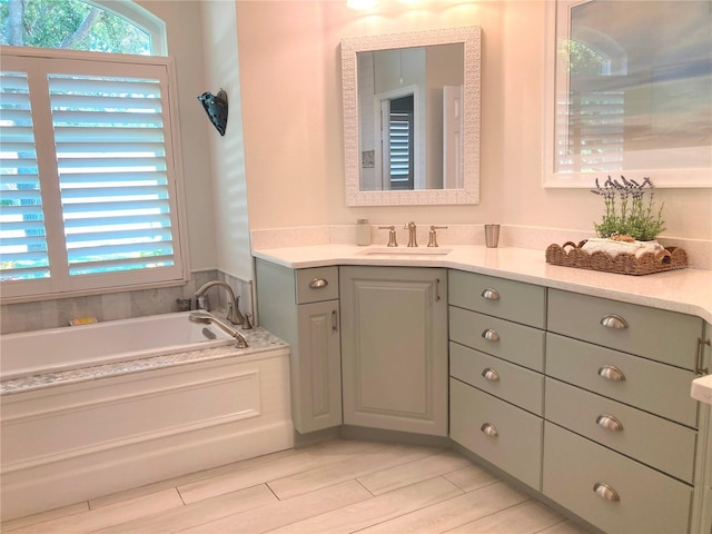 2149 Muskogee Trl, Nokomis, FL 34275 - full bath featuring vanity, a bath, and wood finish floors