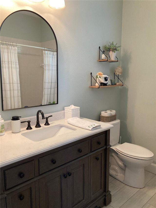 2149 Muskogee Trl, Nokomis, FL 34275 - bathroom with toilet, vanity, and a shower with shower curtain