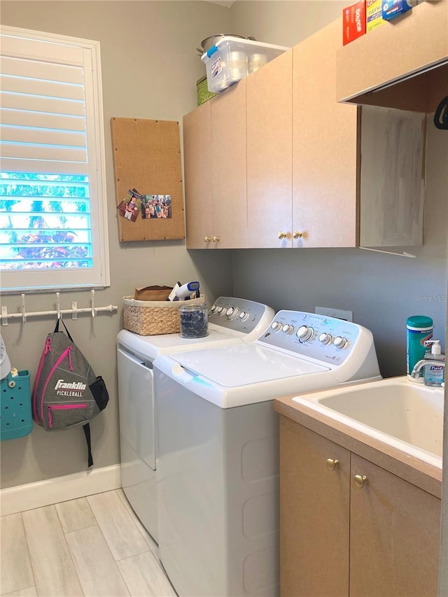 2149 Muskogee Trl, Nokomis, FL 34275 - washroom with cabinet space, washer and clothes dryer, and baseboards