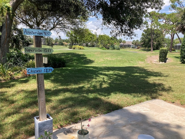 2149 Muskogee Trl, Nokomis, FL 34275 - view of grassy yard featuring a patio