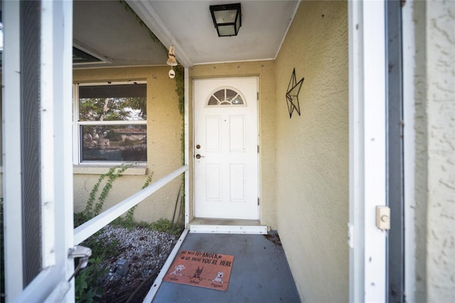 3468 Roslyn Rd, Venice, FL 34293 - doorway to property with stucco siding