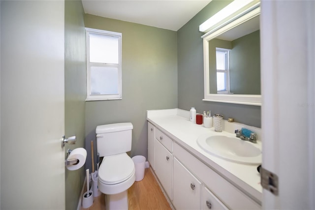 3468 Roslyn Rd, Venice, FL 34293 - bathroom featuring toilet, vanity, and wood finished floors