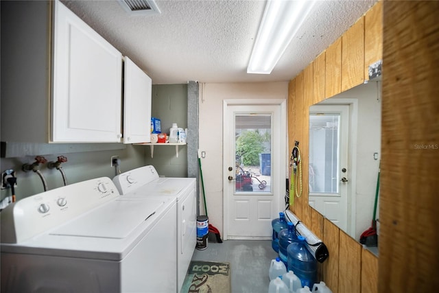 3468 Roslyn Rd, Venice, FL 34293 - laundry room with cabinet space, washer and dryer, and a textured ceiling