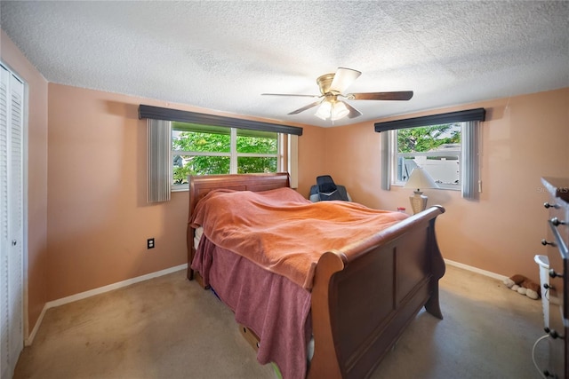 3468 Roslyn Rd, Venice, FL 34293 - bedroom featuring light carpet, baseboards, a textured ceiling, and ceiling fan