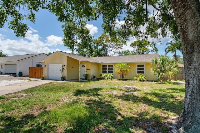 4076 Vana Dr, Sarasota, FL 34241 - ranch-style house with an attached garage and concrete driveway