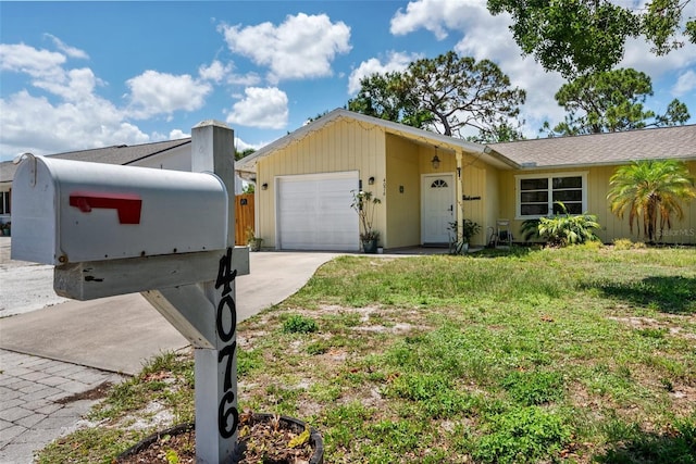 4076 Vana Dr, Sarasota, FL 34241 - single story home with an attached garage, concrete driveway, and a front lawn