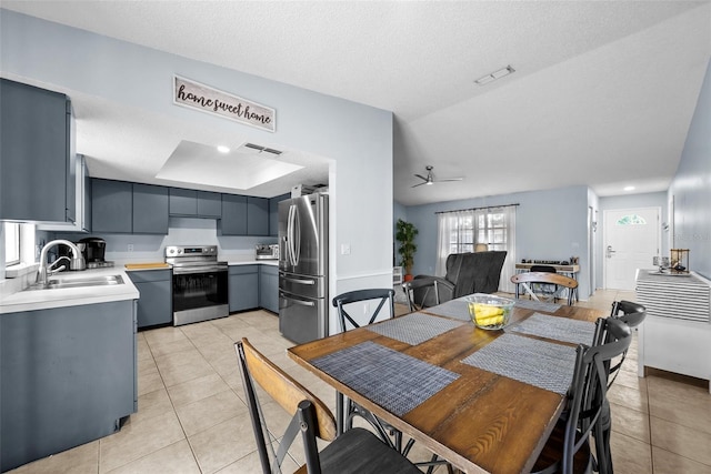 4076 Vana Dr, Sarasota, FL 34241 - dining area with light tile patterned flooring, ceiling fan, and a textured ceiling