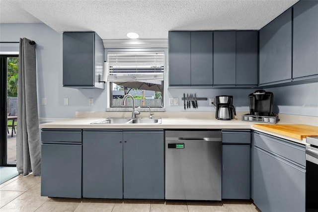 4076 Vana Dr, Sarasota, FL 34241 - kitchen featuring dishwasher, a sink, a textured ceiling, gray cabinets, and light countertops