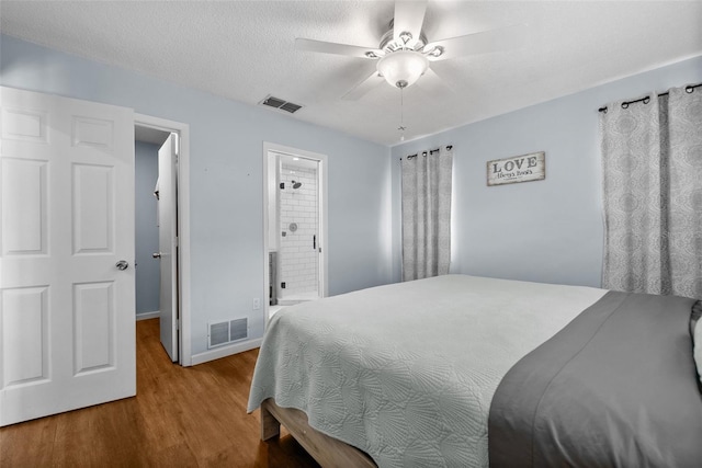 4076 Vana Dr, Sarasota, FL 34241 - bedroom with wood finished floors, baseboards, a ceiling fan, and ensuite bathroom