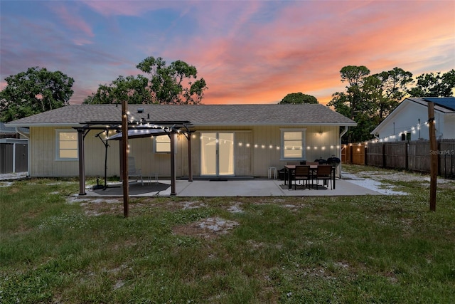 4076 Vana Dr, Sarasota, FL 34241 - back of property at dusk with a patio area