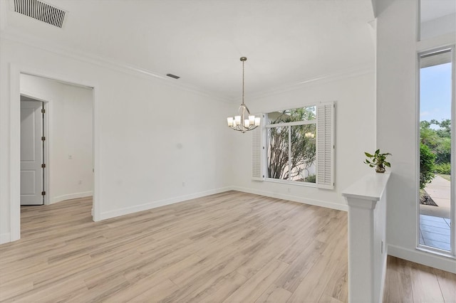 2914 Dick Wilson Dr, Sarasota, FL 34240 - unfurnished room featuring a chandelier, ornamental molding, light wood finished floors, and baseboards