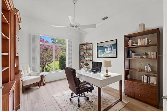2914 Dick Wilson Dr, Sarasota, FL 34240 - home office featuring light wood-style floors, a ceiling fan, and ornamental molding