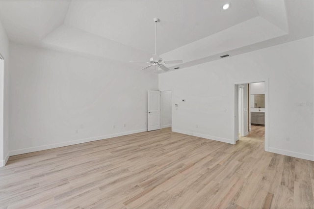 2914 Dick Wilson Dr, Sarasota, FL 34240 - spare room with ceiling fan, light wood-type flooring, baseboards, a raised ceiling, and recessed lighting