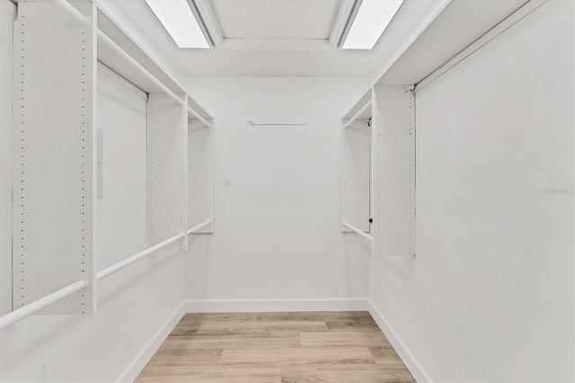 2914 Dick Wilson Dr, Sarasota, FL 34240 - walk in closet featuring light wood-type flooring