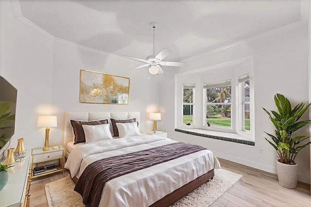 2914 Dick Wilson Dr, Sarasota, FL 34240 - bedroom with wood finished floors, ceiling fan, baseboards, and ornamental molding