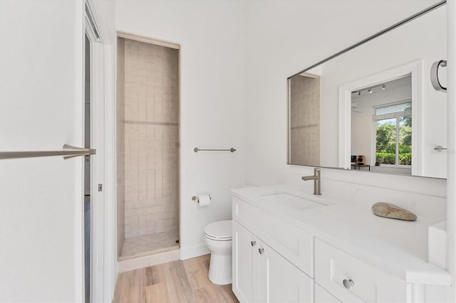 2914 Dick Wilson Dr, Sarasota, FL 34240 - bathroom featuring vanity, toilet, and a tile shower