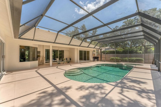 2914 Dick Wilson Dr, Sarasota, FL 34240 - view of swimming pool with a patio area, a pool with connected hot tub, and glass enclosure