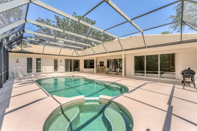 2914 Dick Wilson Dr, Sarasota, FL 34240 - view of pool with french doors, a patio, a pool with connected hot tub, and a lanai